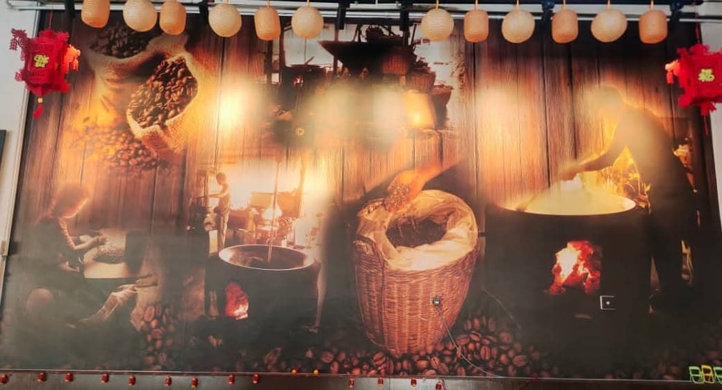 Nanyang coffee-roasting mural inside Orange Kopitiam